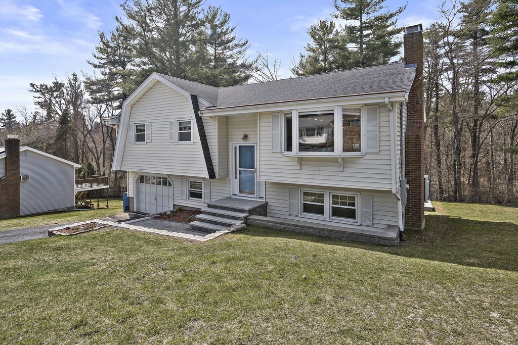 29 Dix Rd Extension Woburn, MA 01801 - Photo 3 of 40 a view of a house with backyard and a tree