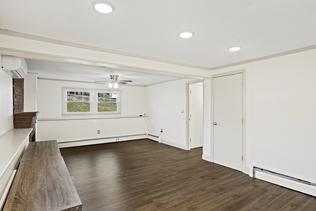 29 Dix Rd Extension Woburn, MA 01801 - Photo 33 of 40 an empty room with wooden floor and windows
