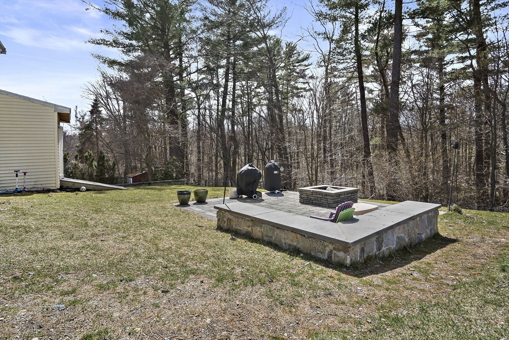 29 Dix Rd Extension Woburn, MA 01801 - Photo 39 of 40 a view of a house with a yard and sitting area