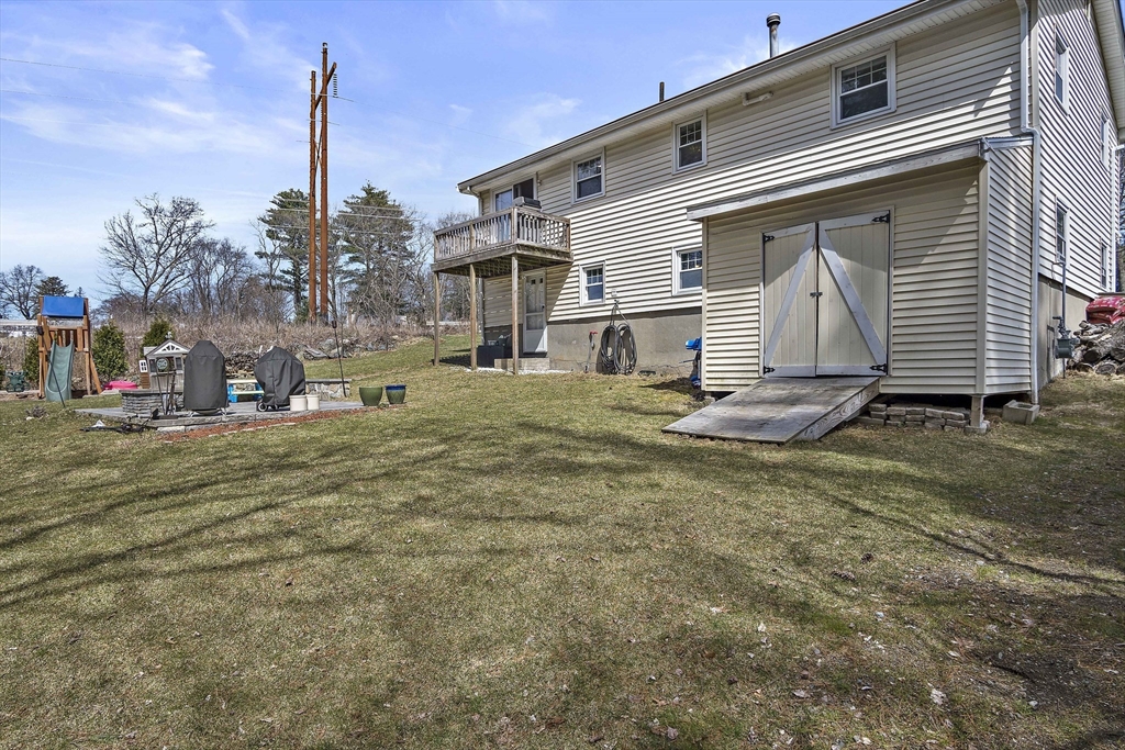 29 Dix Rd Extension Woburn, MA 01801 - Photo 40 of 40 a view of a house with backyard and trees