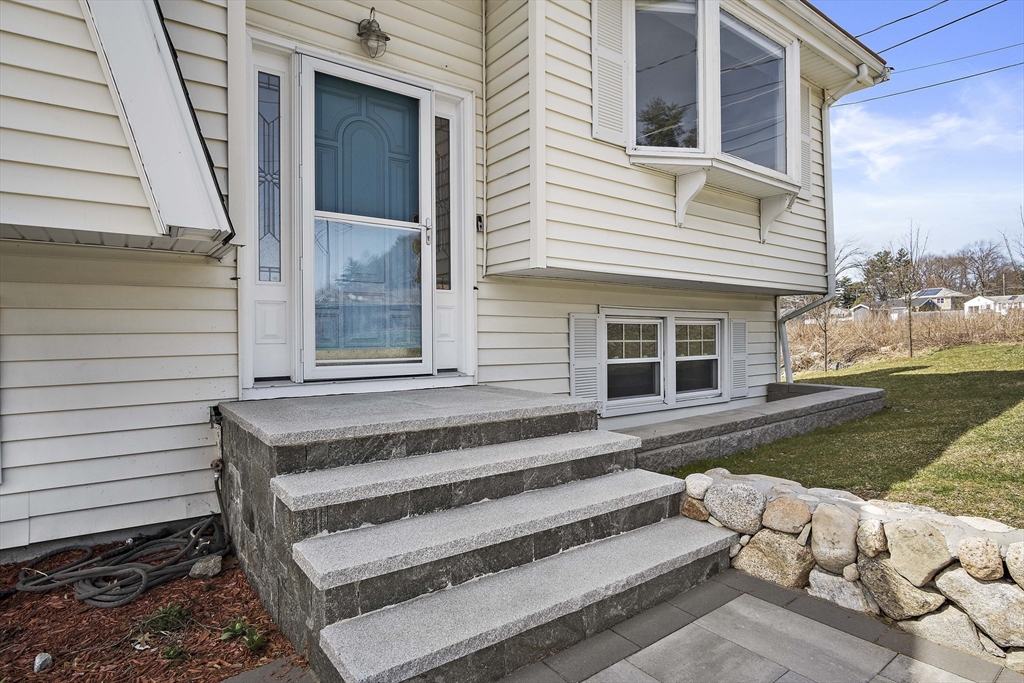 29 Dix Rd Extension Woburn, MA 01801 - Photo 4 of 40 a view of a house with a yard
