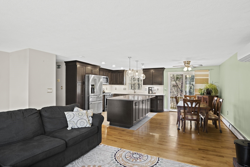 29 Dix Rd Extension Woburn, MA 01801 - Photo 10 of 40 a living room with stainless steel appliances furniture and a kitchen view