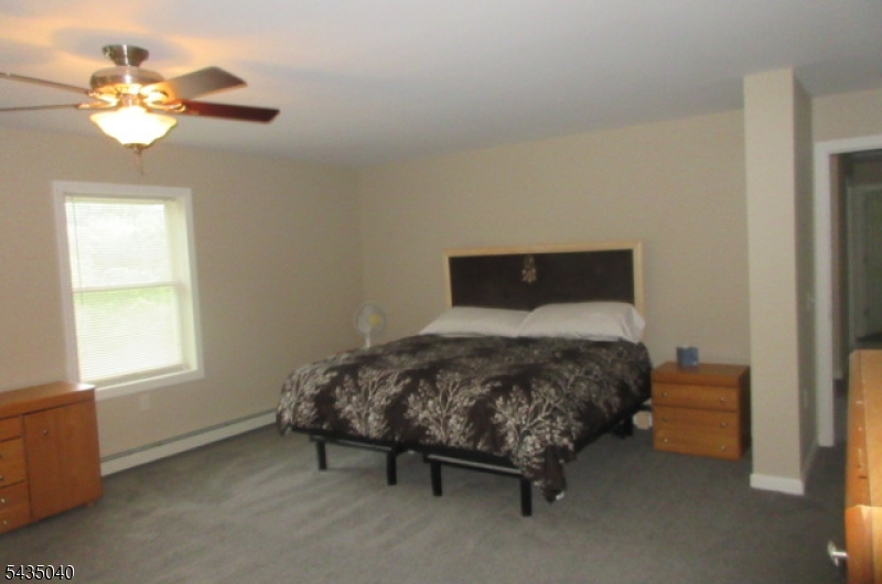 28 Beaver Run Road Lafayette, NJ 07848 - Photo 12 of 36 a bedroom with a bed and a window