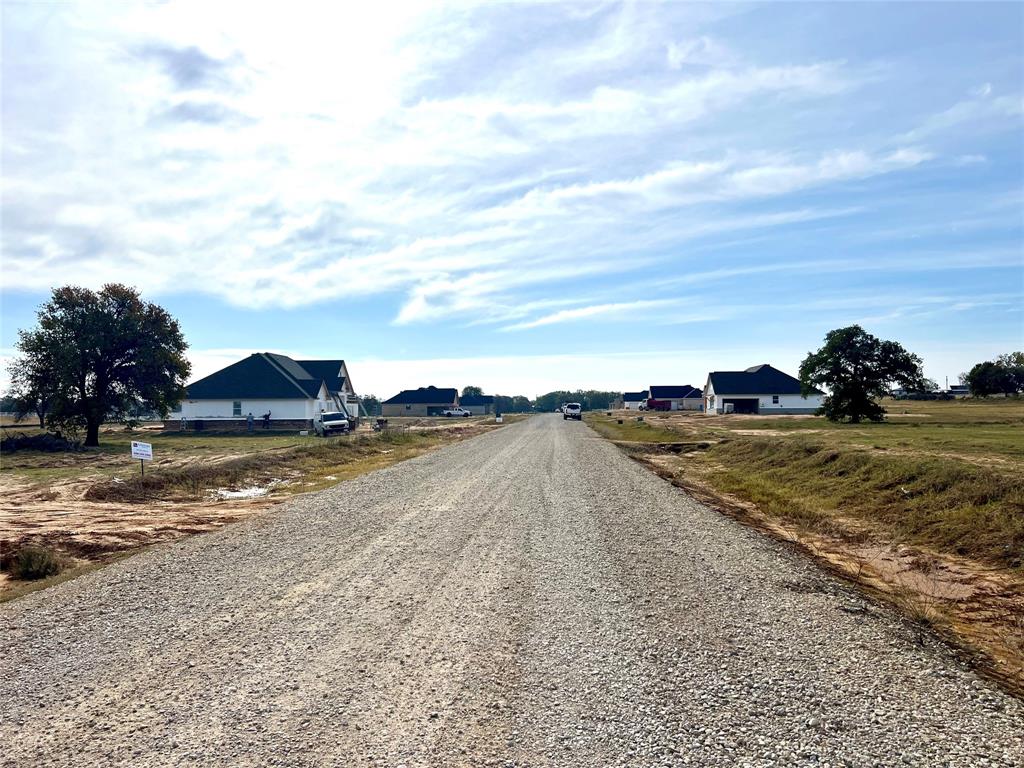 304 Zion Ridge Ridge Poolville, TX 76487 - Photo 4 of 6 a view of a town with an ocean beach