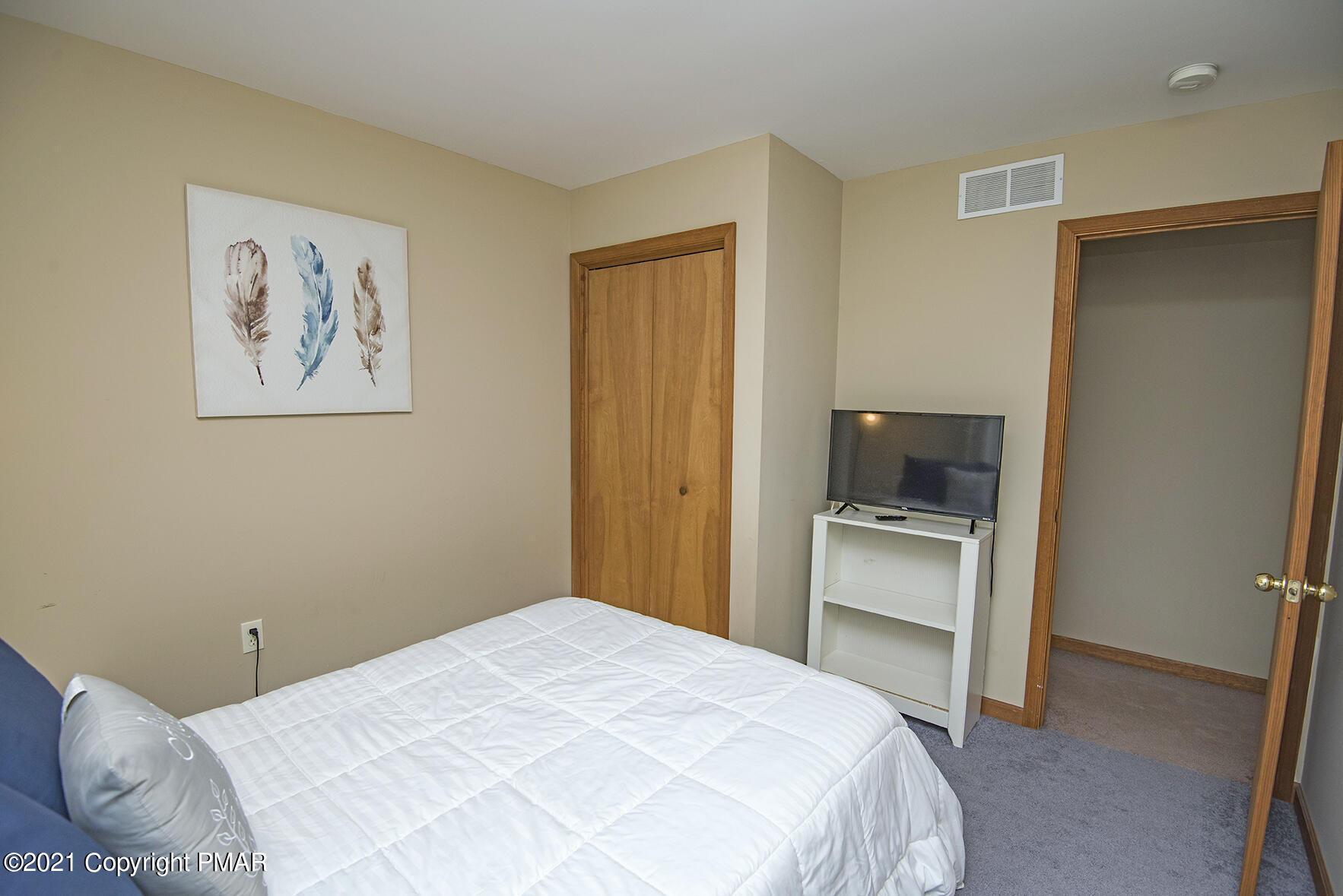 419 Canterbury Road Bushkill, PA 18324 - Photo 31 of 50 a bedroom with a bed and a television