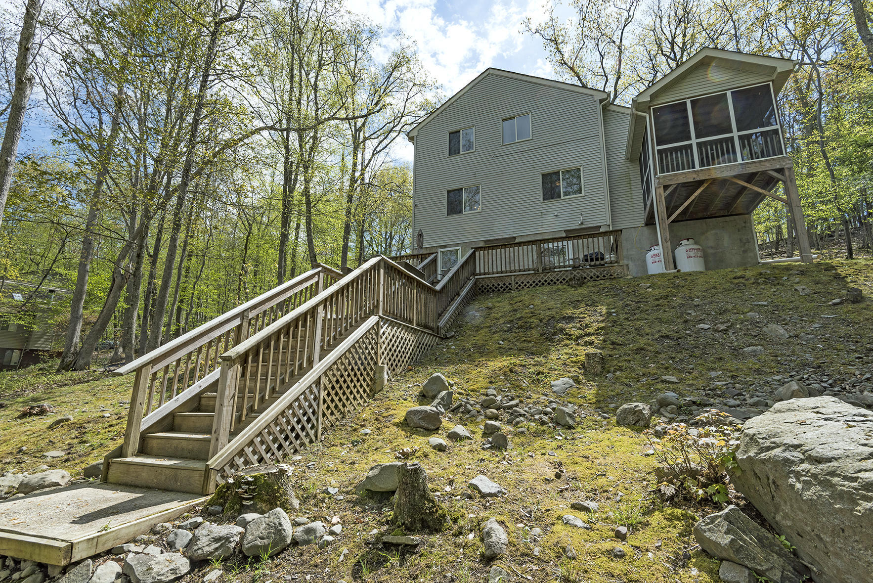 419 Canterbury Road Bushkill, PA 18324 - Photo 44 of 50 a view of a house with backyard and sitting area