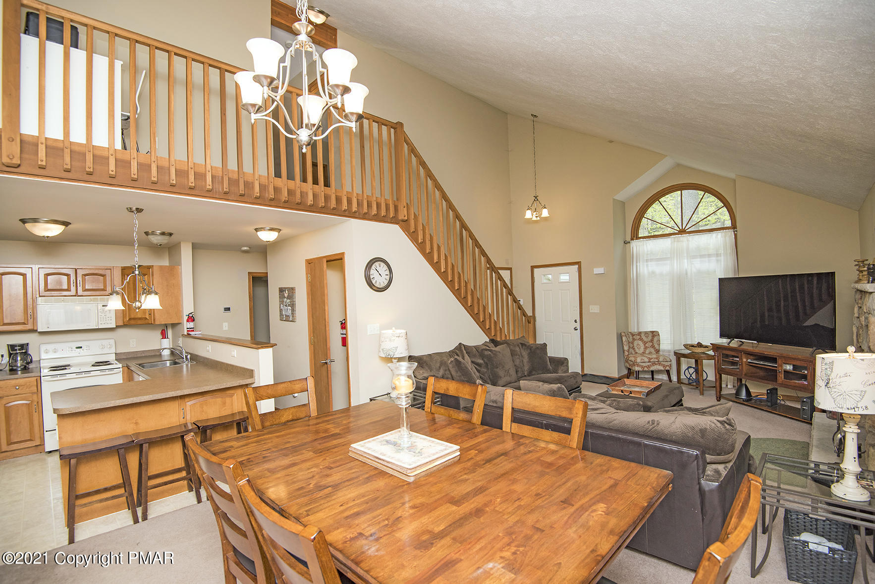 419 Canterbury Road Bushkill, PA 18324 - Photo 8 of 50 a living room with furniture a fireplace and a flat screen tv