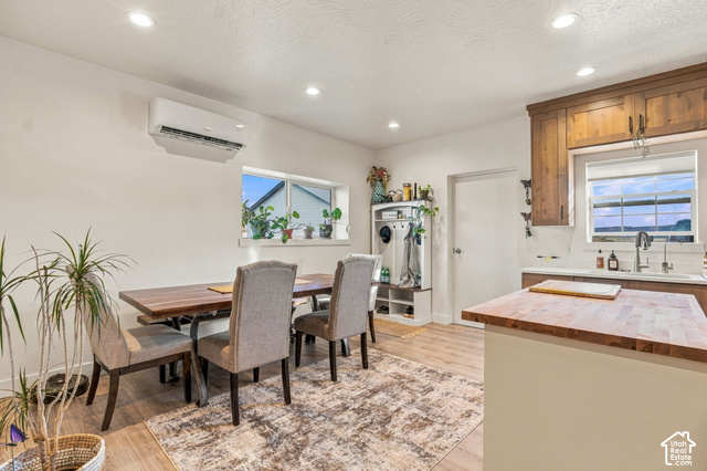 215 South Copper Road East Kanab, UT 84741 - Photo 12 of 41 Recessed lighting illuminates the dining area with wood-finish flooring