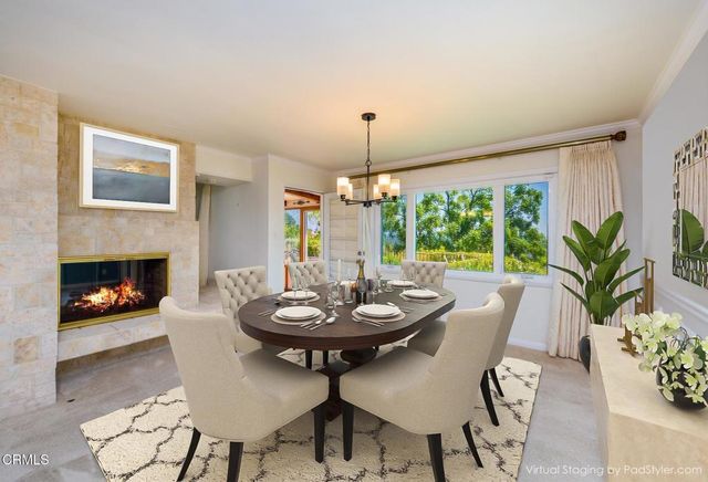 a kitchen with granite countertop a sink appliances and cabinets
