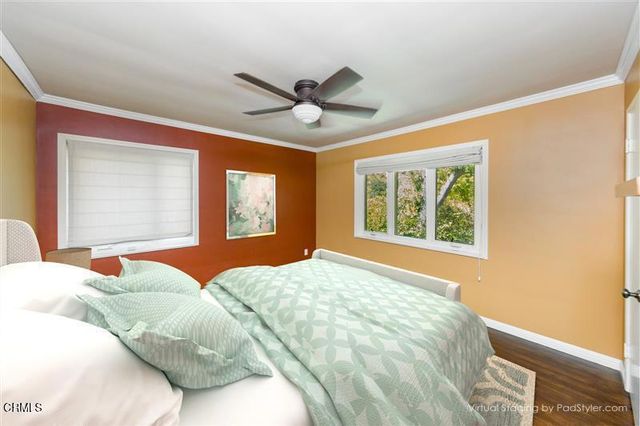 a view of a house with backyard sitting area and garden