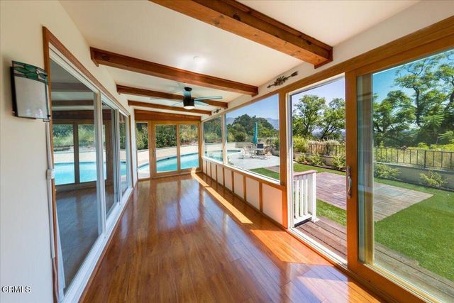 a view of a livingroom with hardwood and furniture