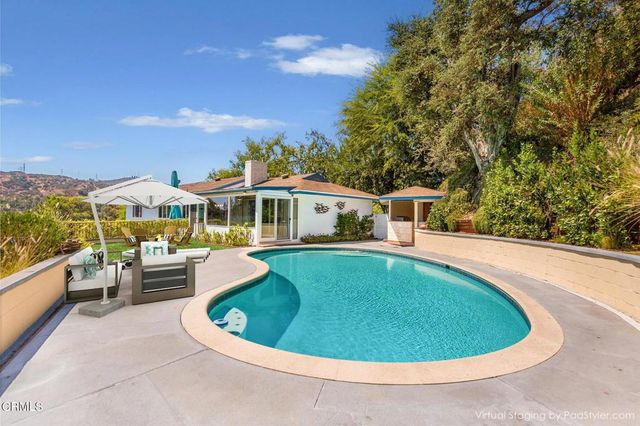 a bedroom with a bed and a table in it