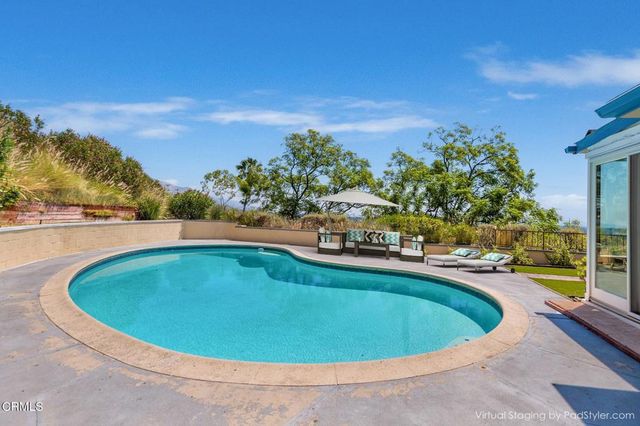 a kitchen that has a stove and a table in it