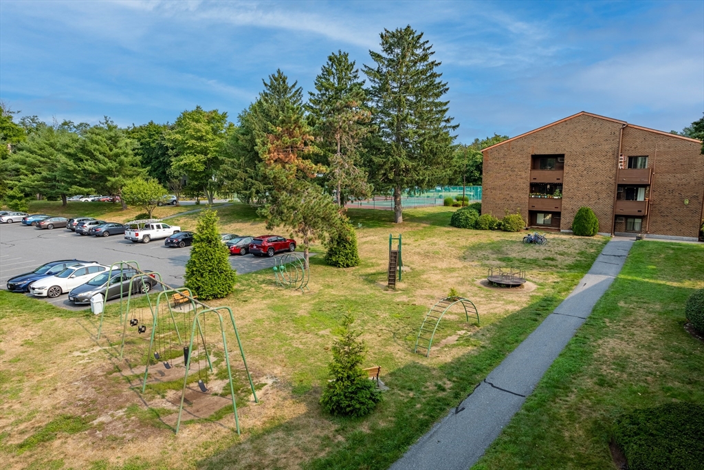 17 Davis Road, Unit C9 Acton, MA 01720 - Photo 24 of 26 a view of yard with swimming pool and trees