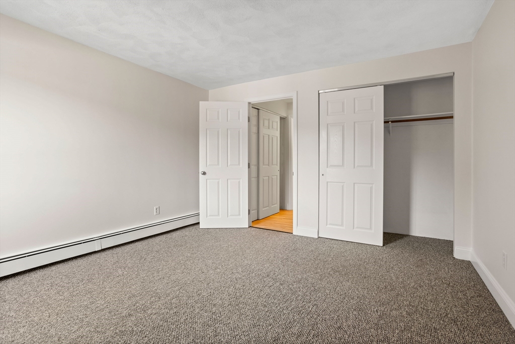 17 Davis Road, Unit C9 Acton, MA 01720 - Photo 3 of 26 a view of an empty room with closet area