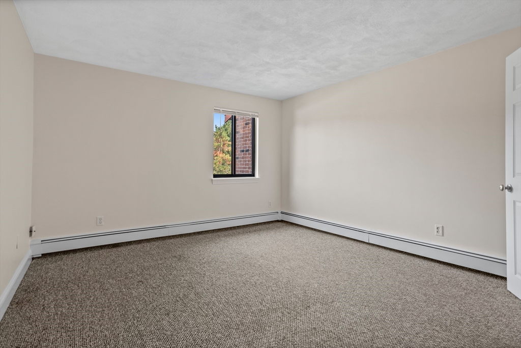 17 Davis Road, Unit C9 Acton, MA 01720 - Photo 4 of 26 an empty room with a window