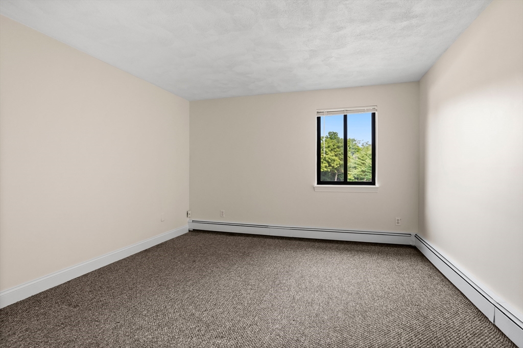 17 Davis Road, Unit C9 Acton, MA 01720 - Photo 5 of 26 an empty room with a window