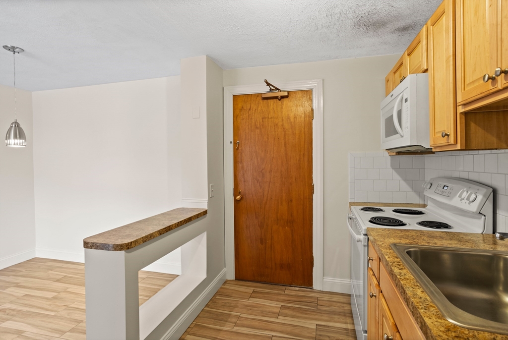 17 Davis Road, Unit C9 Acton, MA 01720 - Photo 10 of 26 a utility room with dryer and washer