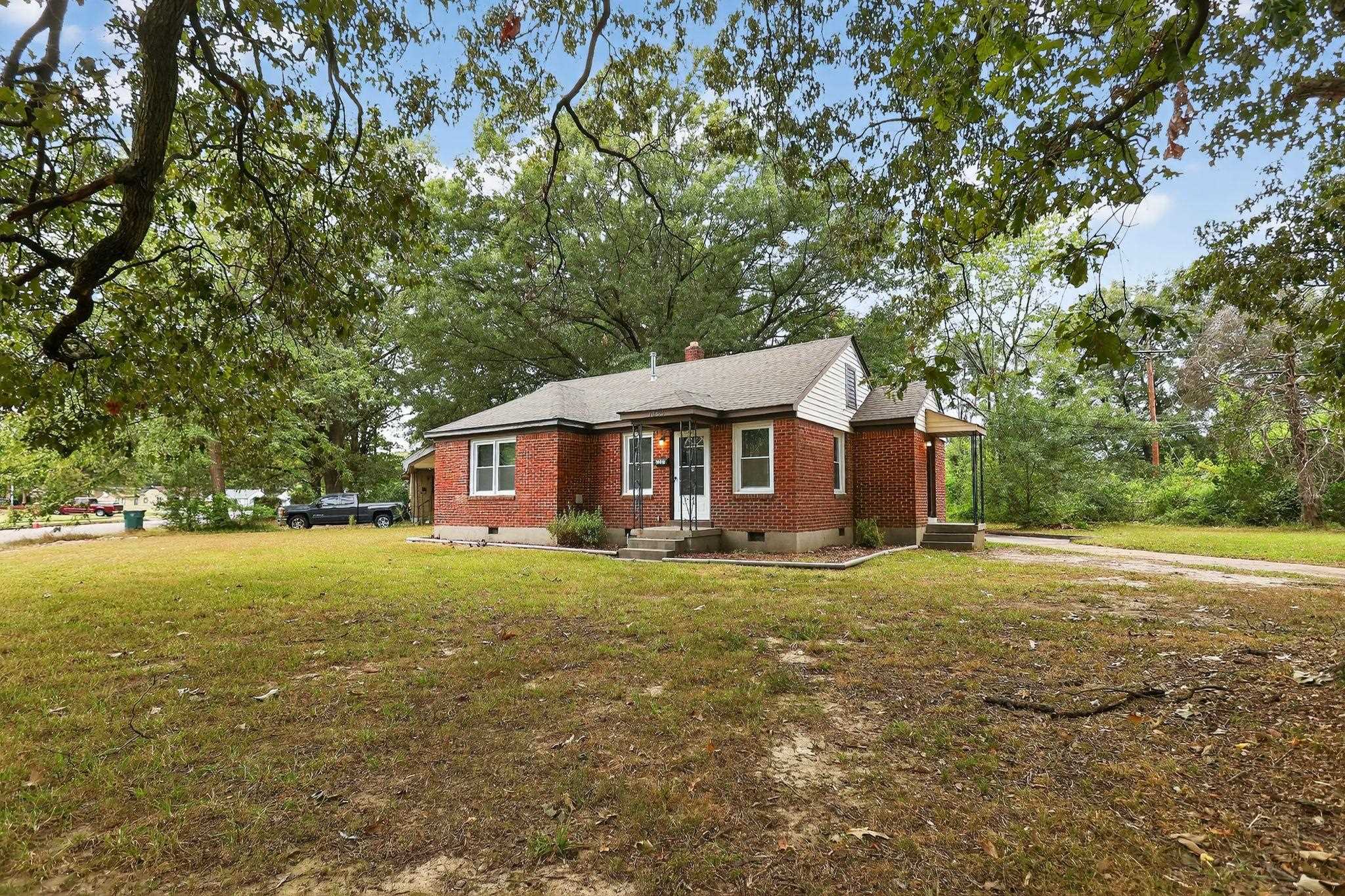 1563 Flamingo Road Memphis, TN 38117 - Photo 34 of 38 Ranch-style home featuring crawl space, brick siding, a front yard, and a chimney