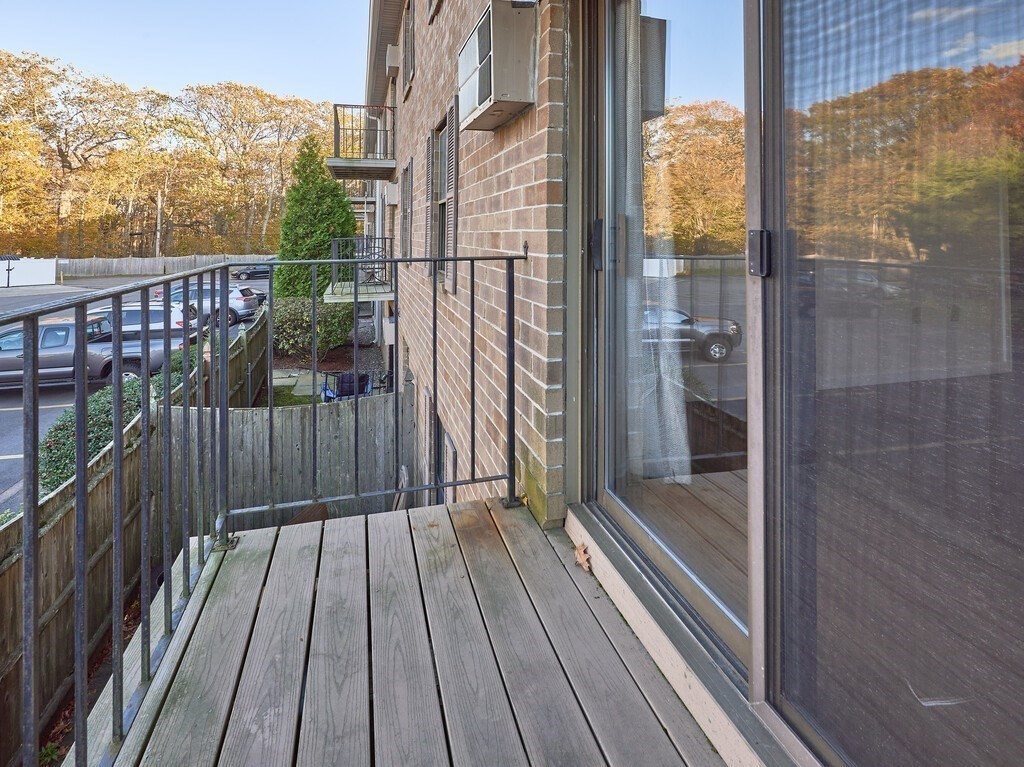 80 Stanton Street, Unit 14 Worcester, MA 01605 - Photo 13 of 26 a view of balcony with wooden floor and city view