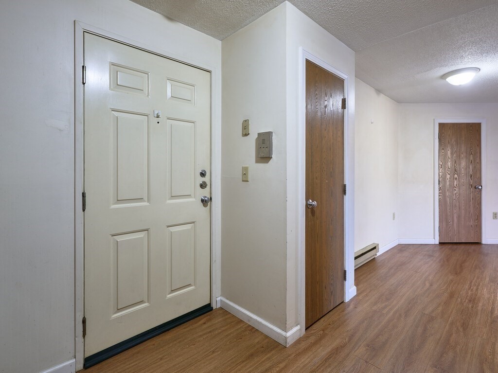 80 Stanton Street, Unit 14 Worcester, MA 01605 - Photo 14 of 26 a view of a hallway with wooden floor