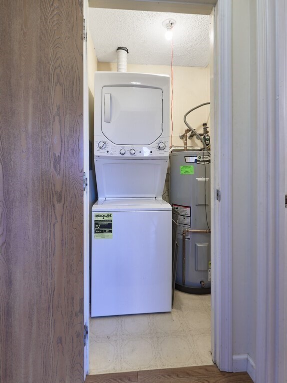 80 Stanton Street, Unit 14 Worcester, MA 01605 - Photo 21 of 26 a utility room with dryer and washer