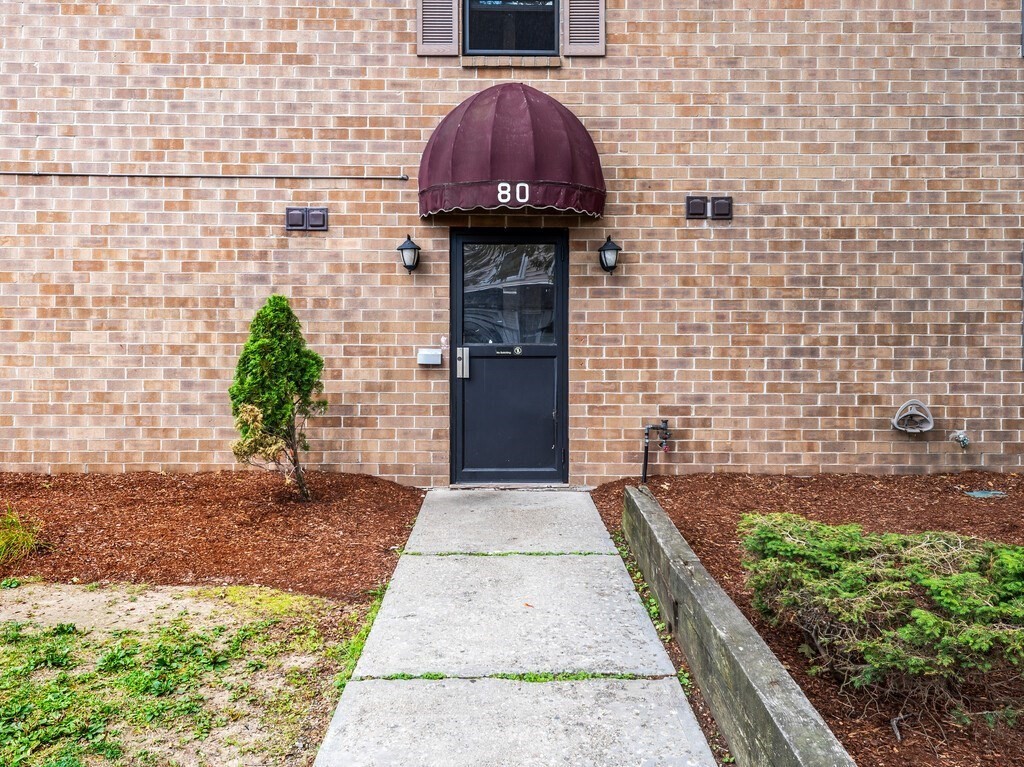 80 Stanton Street, Unit 14 Worcester, MA 01605 - Photo 3 of 26 a view of entryway with a garden
