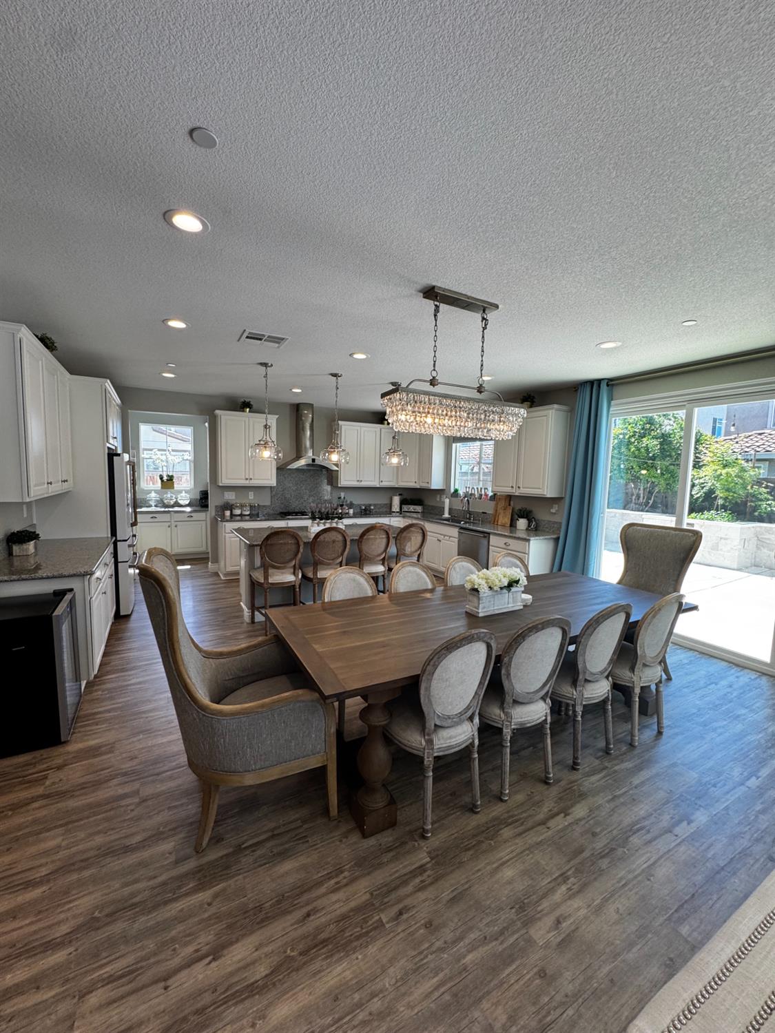 8026 Prairie Hawk Way Sacramento, CA 95829 - Photo 11 of 30 a large kitchen with a table and chairs