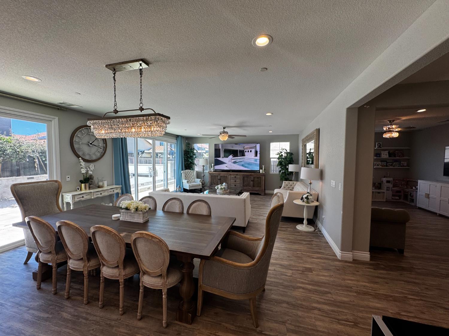 8026 Prairie Hawk Way Sacramento, CA 95829 - Photo 12 of 30 a view of a dining room with furniture wooden floor and chandelier