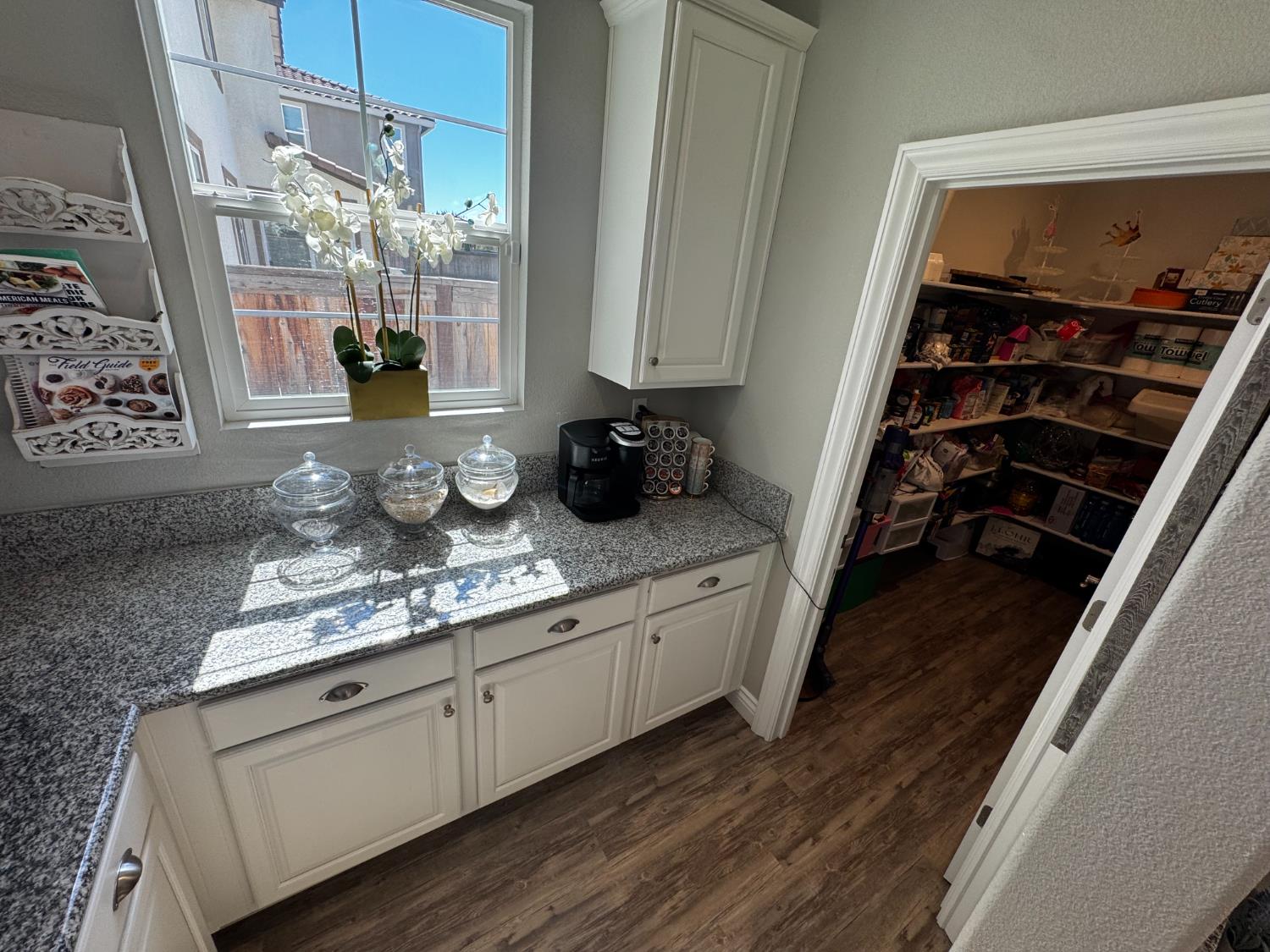 8026 Prairie Hawk Way Sacramento, CA 95829 - Photo 14 of 30 a kitchen with white cabinets and sink