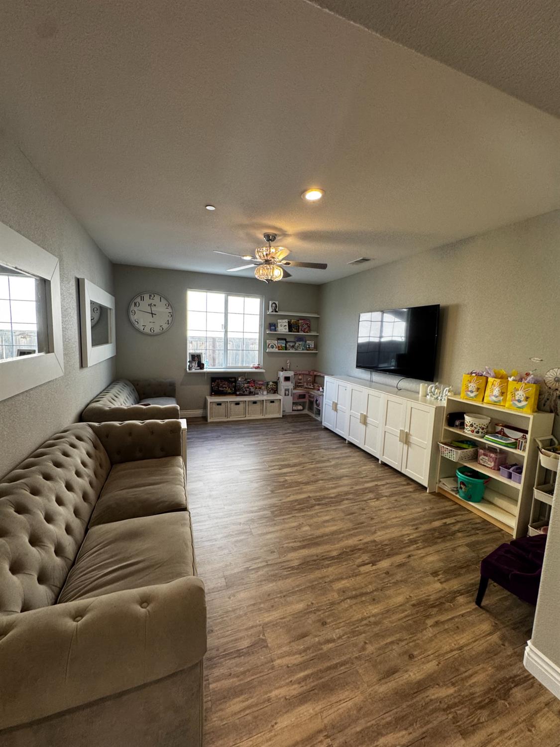 8026 Prairie Hawk Way Sacramento, CA 95829 - Photo 16 of 30 a living room with furniture and a flat screen tv