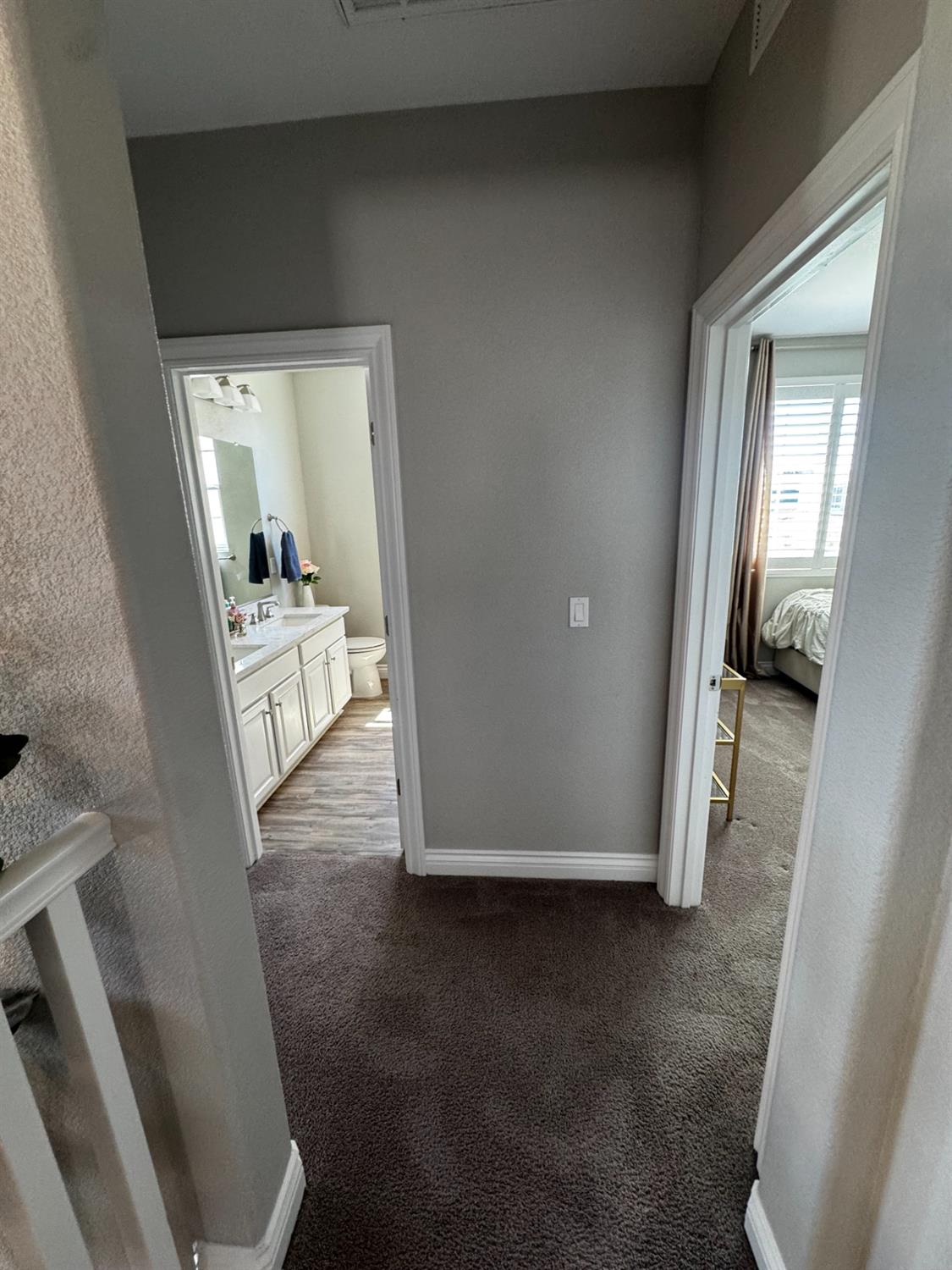 8026 Prairie Hawk Way Sacramento, CA 95829 - Photo 22 of 30 a view of a hallway to a livingroom and a livingroom with furniture