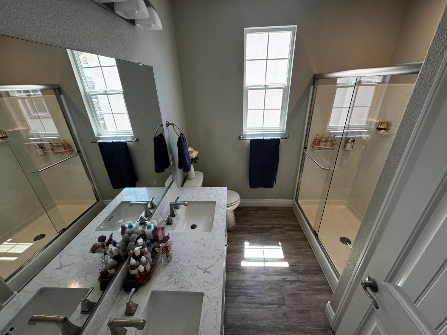 8026 Prairie Hawk Way Sacramento, CA 95829 - Photo 23 of 30 a view of a livingroom with furniture window wooden floor and staircase