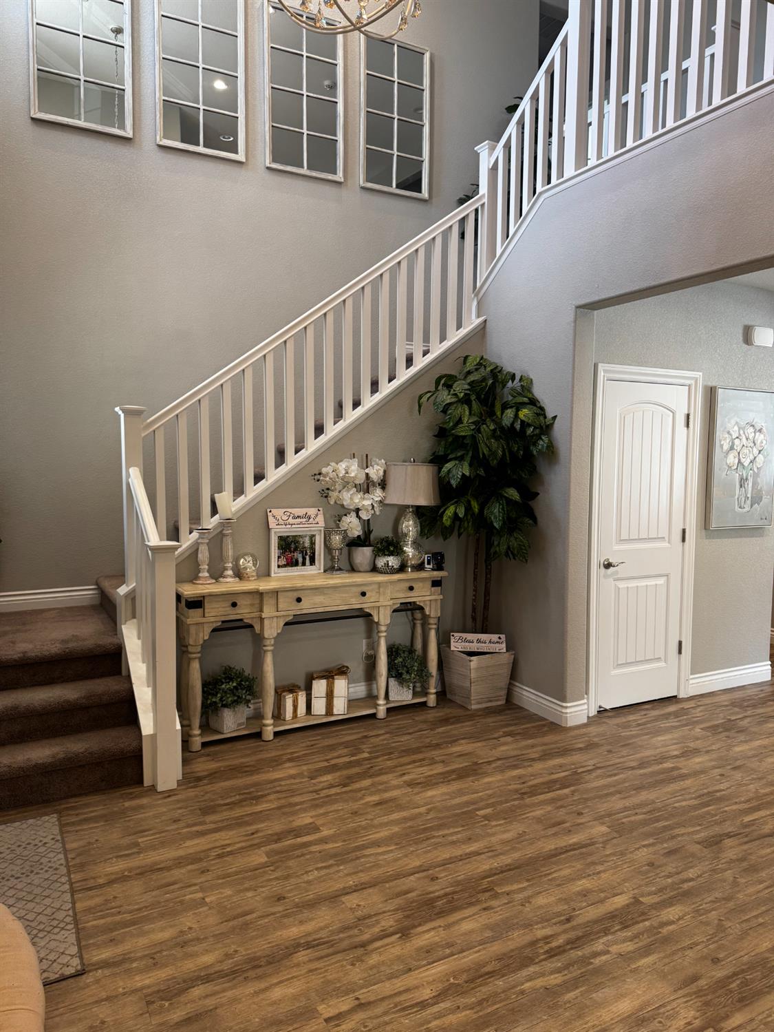8026 Prairie Hawk Way Sacramento, CA 95829 - Photo 4 of 30 a view of entryway and hall with wooden floor