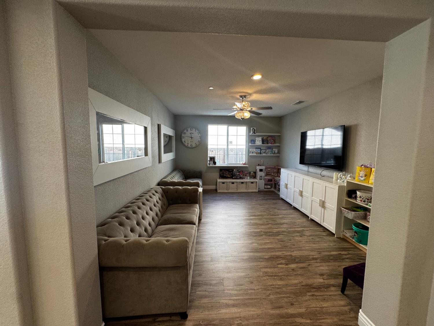 8026 Prairie Hawk Way Sacramento, CA 95829 - Photo 8 of 30 a living room with furniture and a flat screen tv