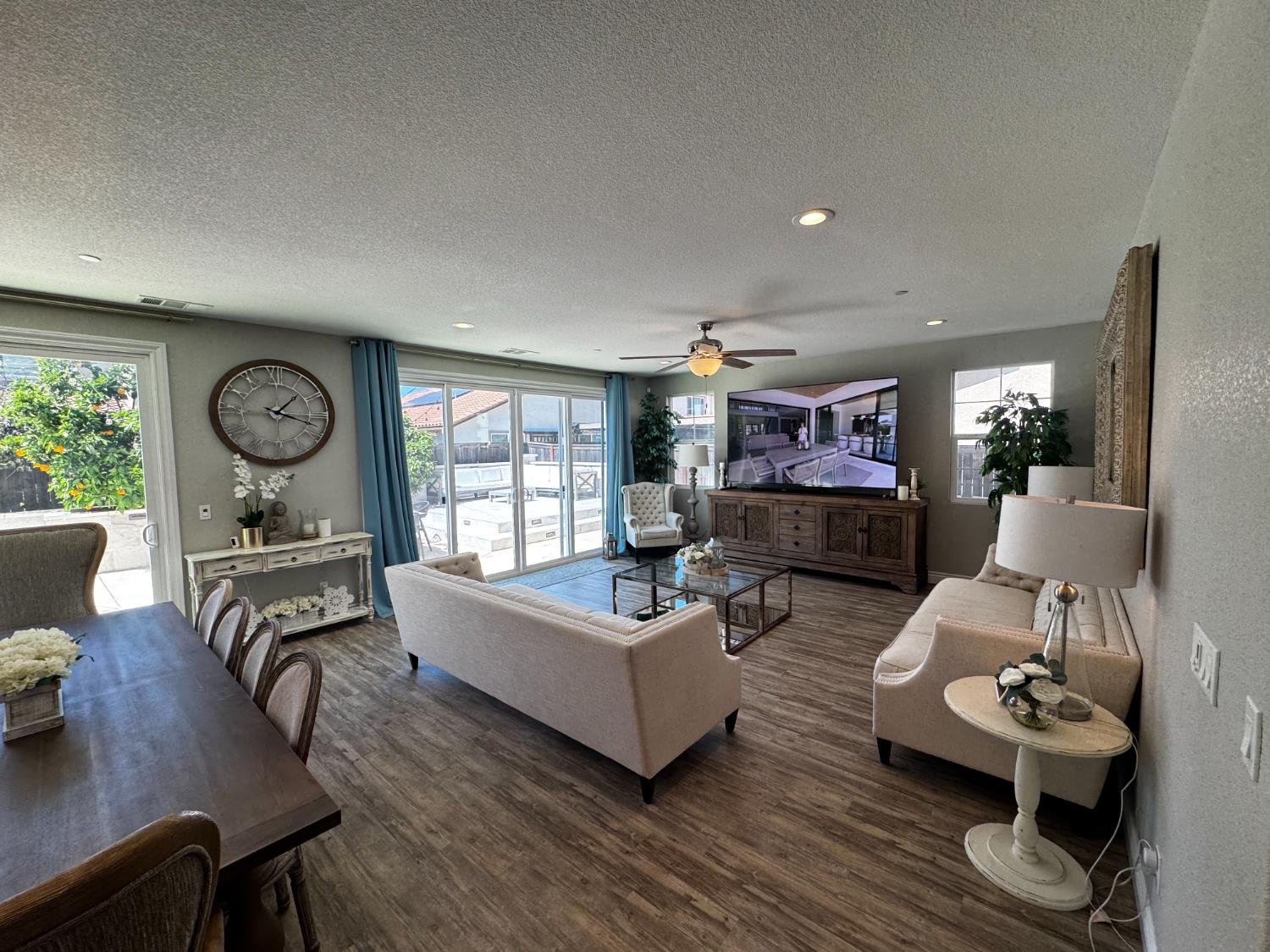 8026 Prairie Hawk Way Sacramento, CA 95829 - Photo 9 of 30 a living room with furniture and wooden floor