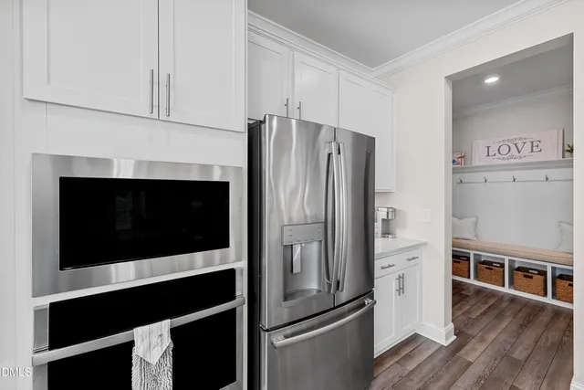 a kitchen with a sink stove and refrigerator