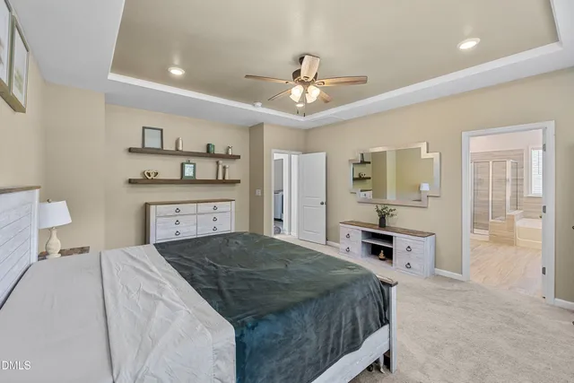 a living room with a bed and a chandelier