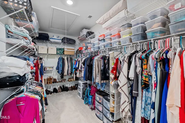 a bathroom with a double vanity sink toilet mirror and bathtub