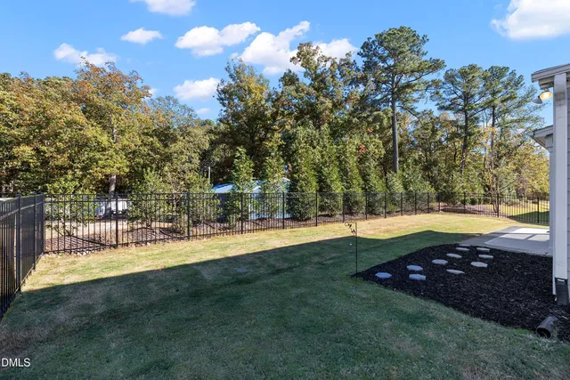a view of a utility room with a sink and a mirror