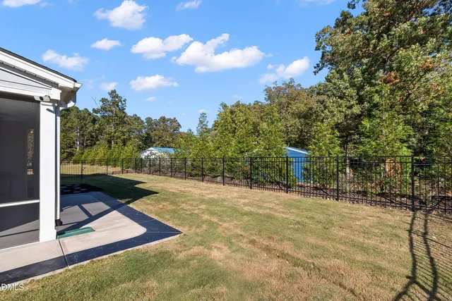 a view of a house with backyard porch and sitting area