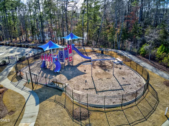 a view of a swimming pool with sitting area