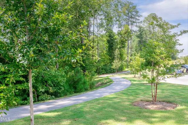 a view of a yard with an outdoor seating