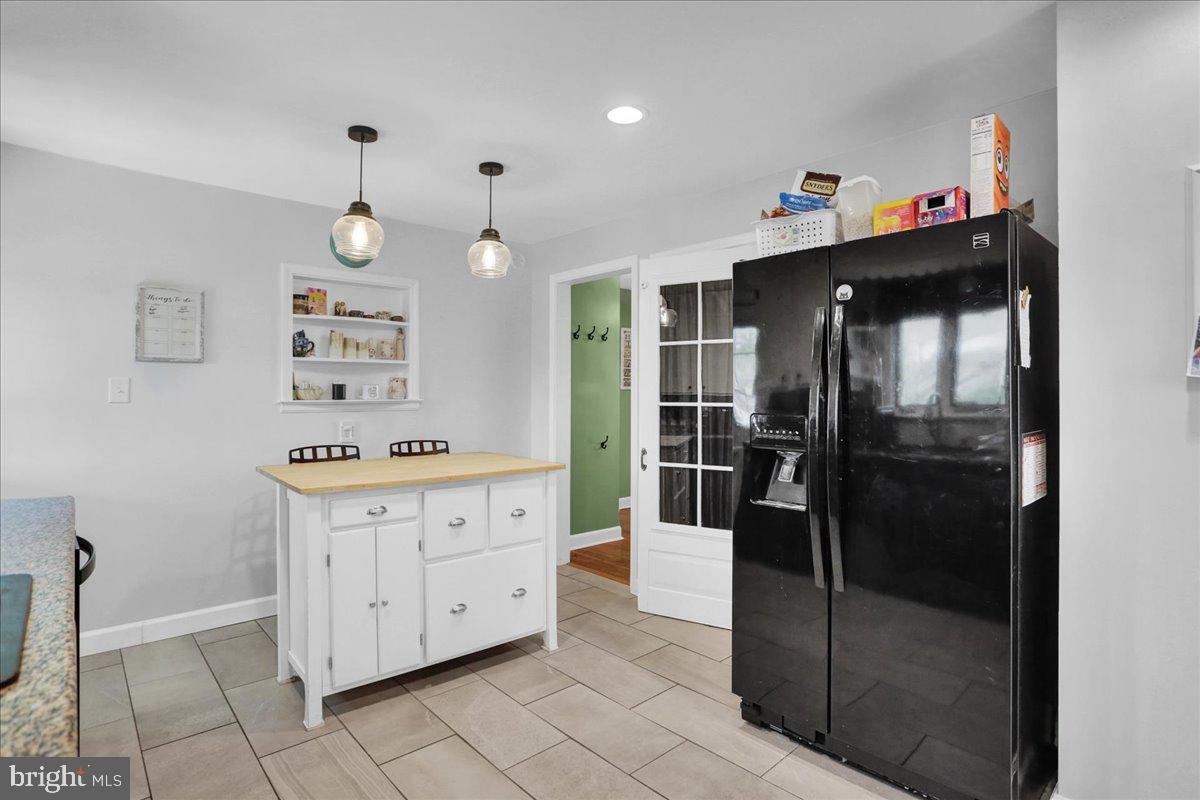 3812 Reiff Place Reading, PA 19606 - Photo 13 of 38 a kitchen with granite countertop a refrigerator and a stove