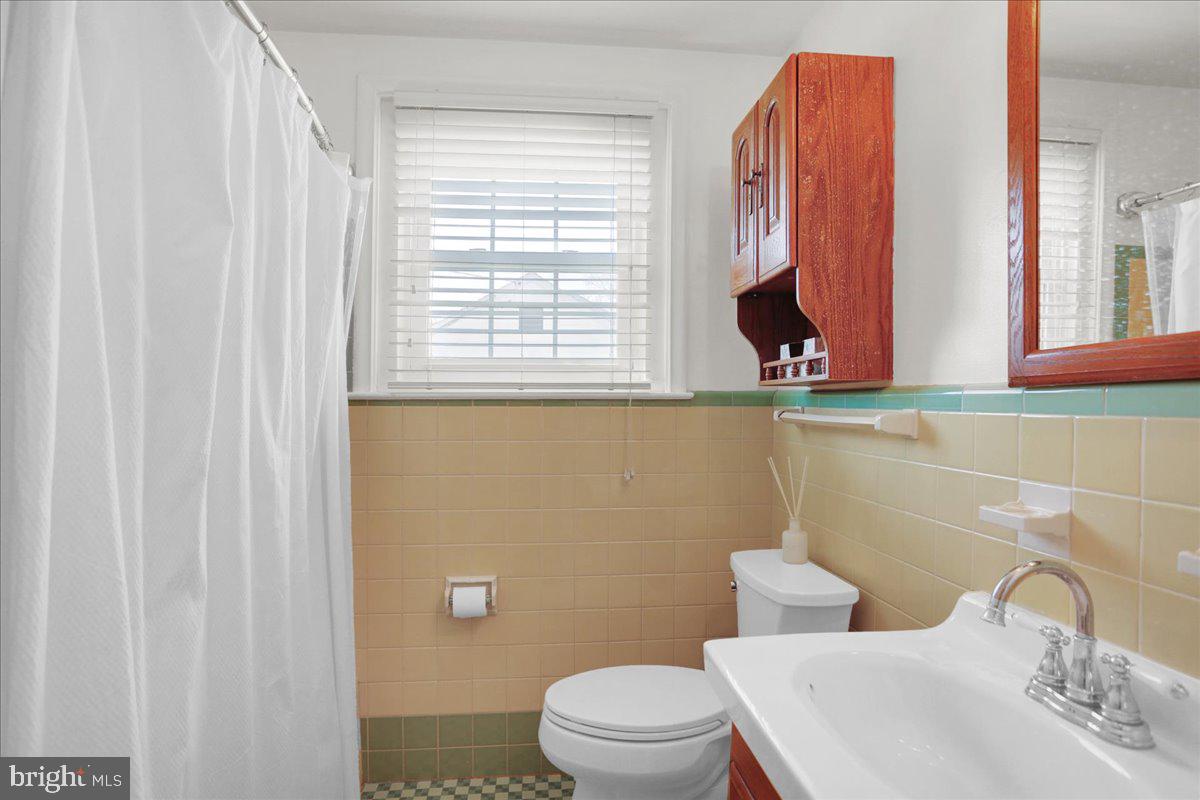 3812 Reiff Place Reading, PA 19606 - Photo 16 of 38 a bathroom with a toilet sink and mirror