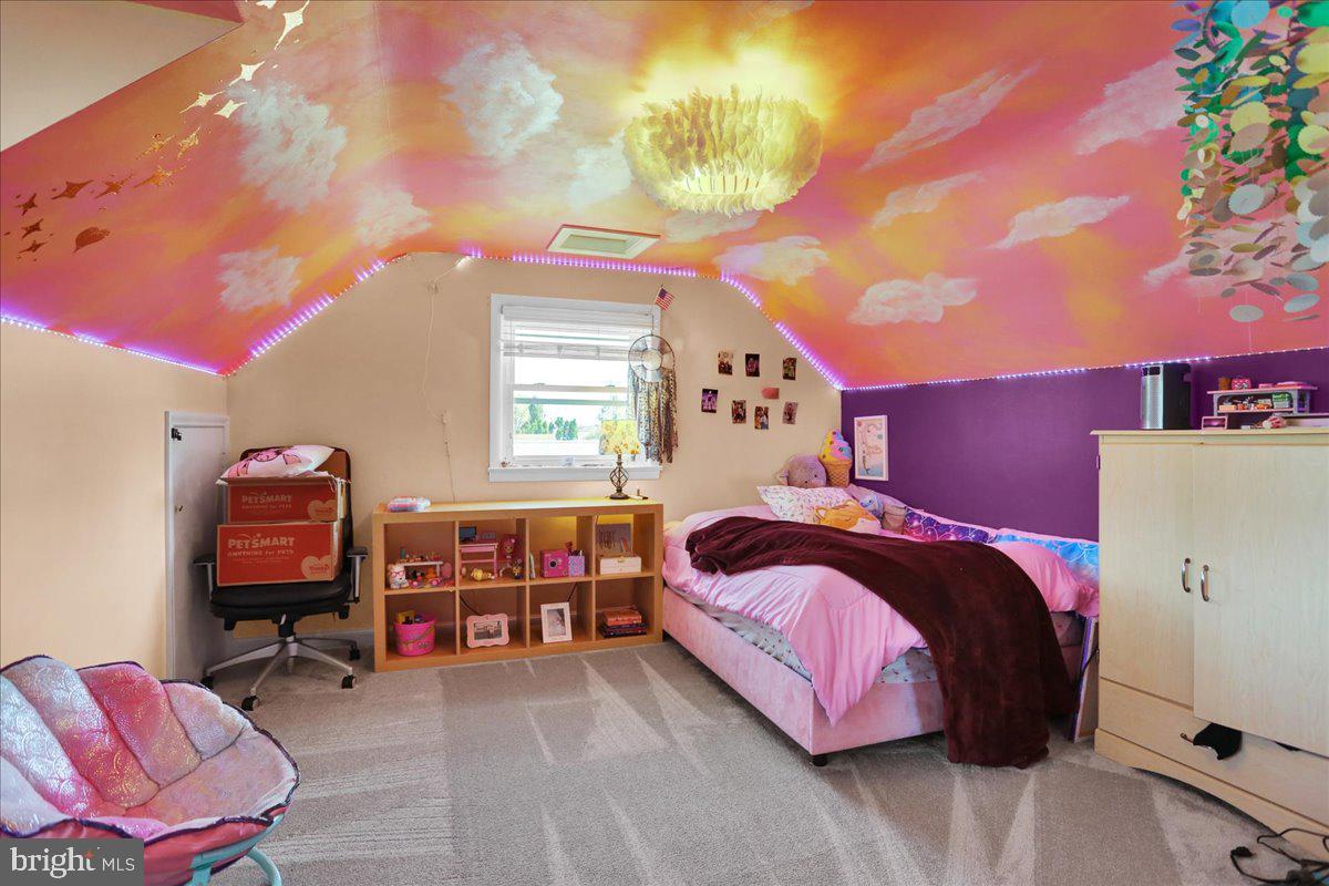3812 Reiff Place Reading, PA 19606 - Photo 20 of 38 a bedroom with a bed and a chandelier
