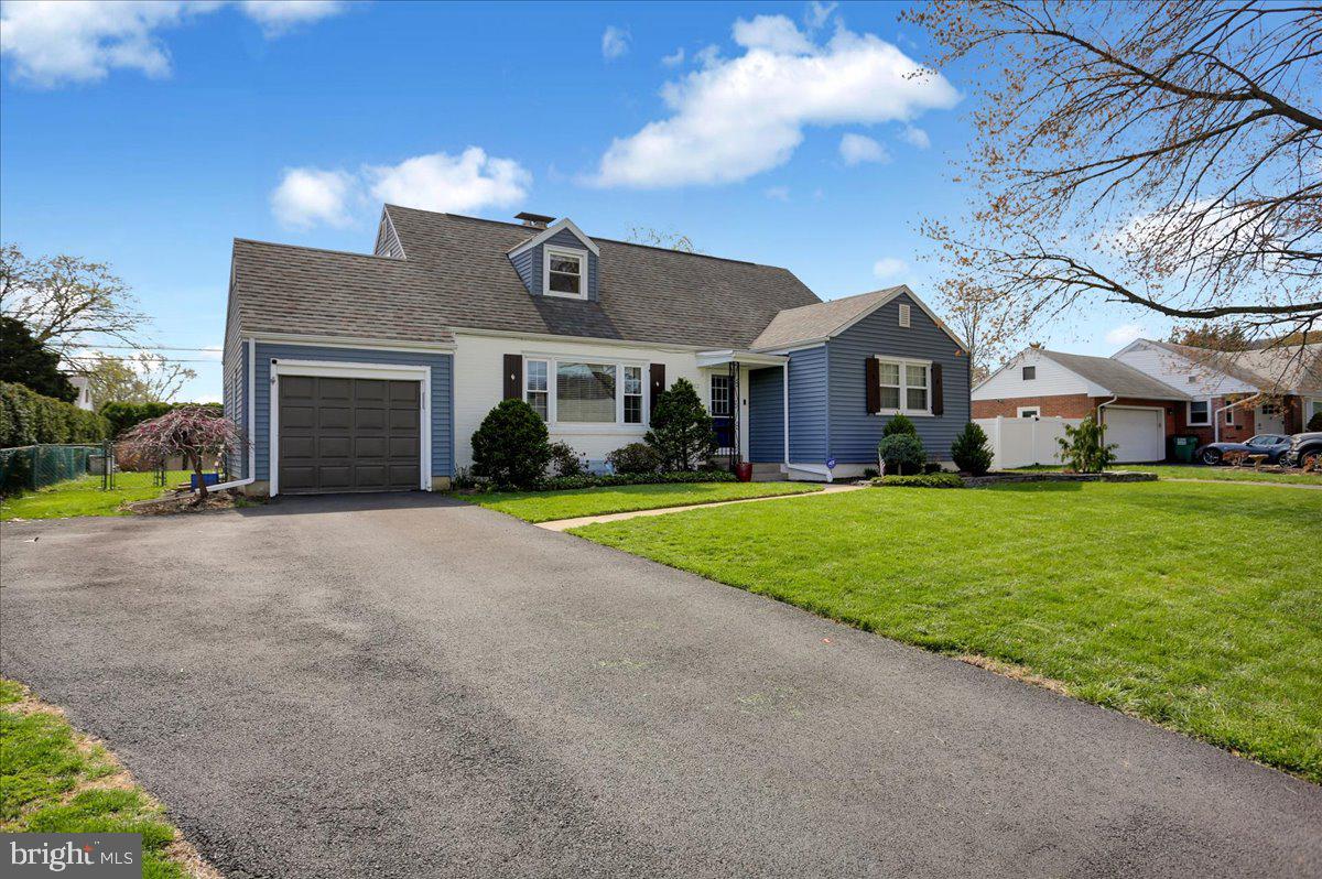 3812 Reiff Place Reading, PA 19606 - Photo 32 of 38 a front view of a house with a yard and garage