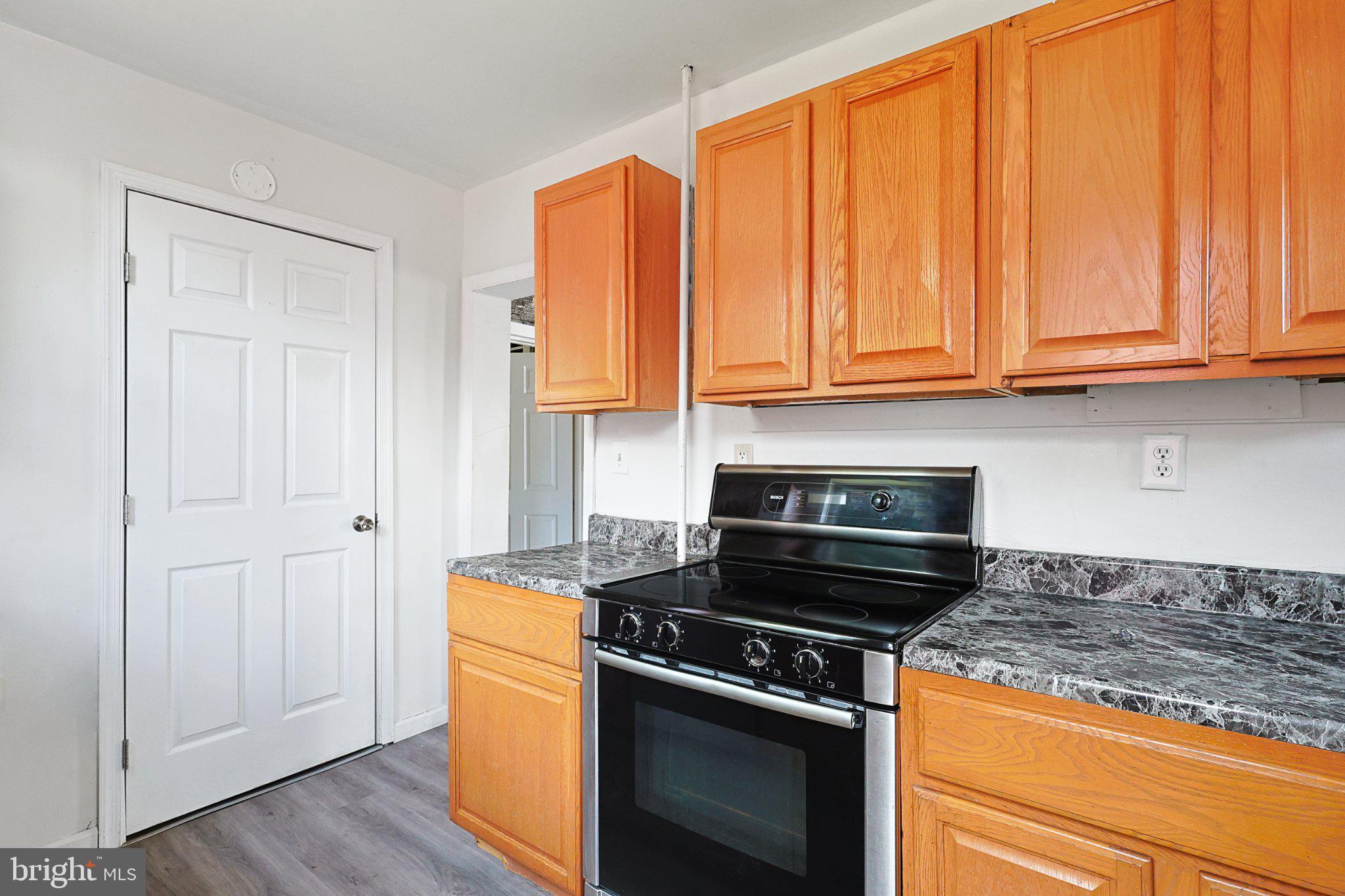 34 Maple Street Frostburg, MD 21532 - Photo 6 of 13 Modern kitchen with warm wood accents.