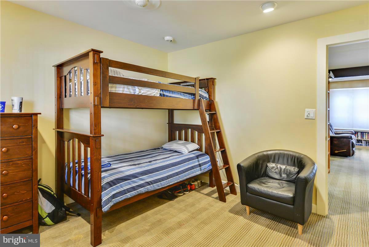 3873 Chain Bridge Road Fairfax, VA 22030 - Photo 11 of 29 a bedroom with a bed and wooden floor