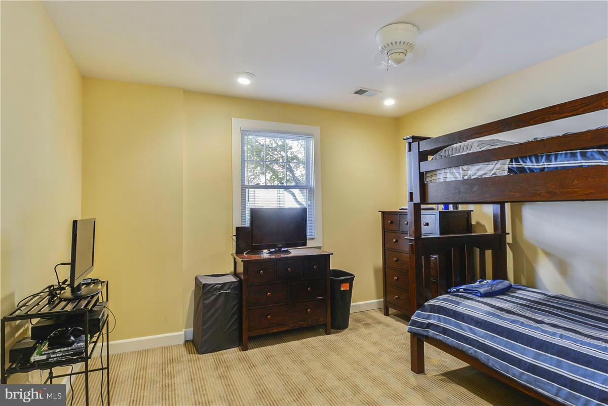 3873 Chain Bridge Road Fairfax, VA 22030 - Photo 12 of 29 a bedroom with a bed and furniture